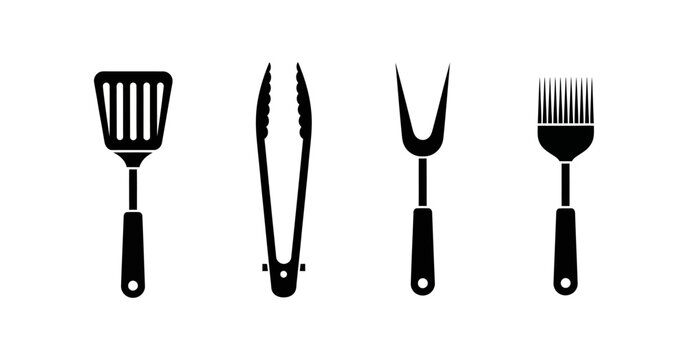 Set of black barbecue utensils including a spatula, tongs, fork, and basting brush, isolated on a white background