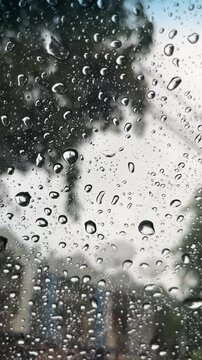 Mesmerizing Close-Up of Raindrops on a Glass Surface During a Stormy Day, Capturing the Essence of Wet Weather