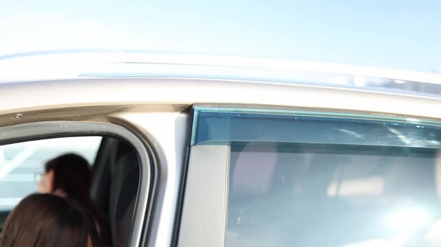 Driving instructor checks student knowledge asks questions and listens answers inside car focused conversation during lesson evaluation process training moment