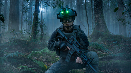 Obraz premium Soldier in tactical gear holding rifle with glowing green night vision goggles on helmet in misty forest at night with ferns on foreground