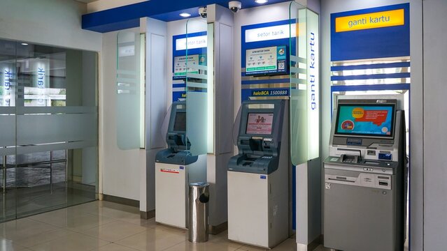 Row of automated teller machines in a modern bank interior on April 17, 2026 in Bogor, Indonesia