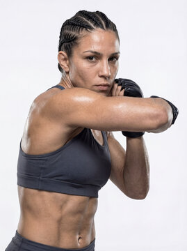 Female MMA Fighter Close Up Guard Stance Anatomically Correct Muscle Tension Kinetic Chain Torque Dark Charcoal Training Gear Studio Lighting High Contrast White Background One-Click Masking Ready