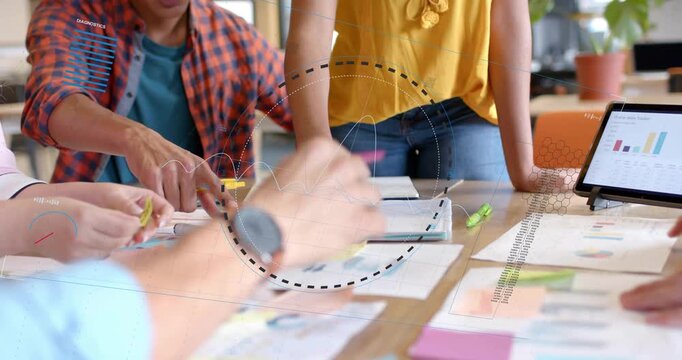 Vertical video: Pointing lead in yellow top urging team moving notes marking papers planning tasks
