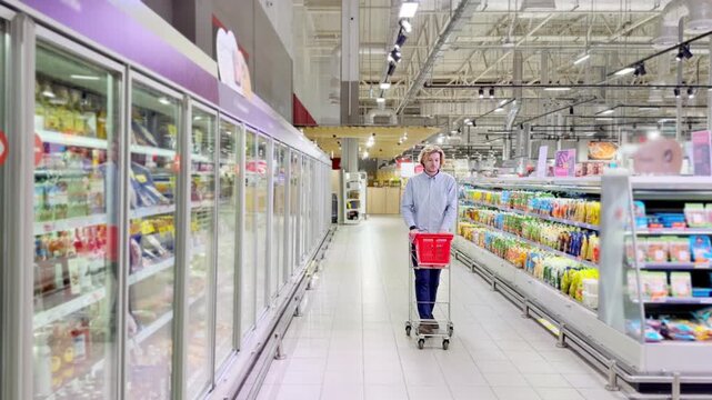 Choosing food from shelf at the supermarket,vegetables in the grocery section, Grocery stores 
