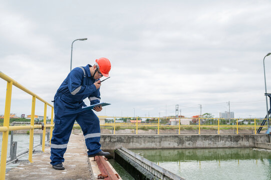 Water plant maintenance technicians, mechanical engineers check the control system at the water treatment plant.