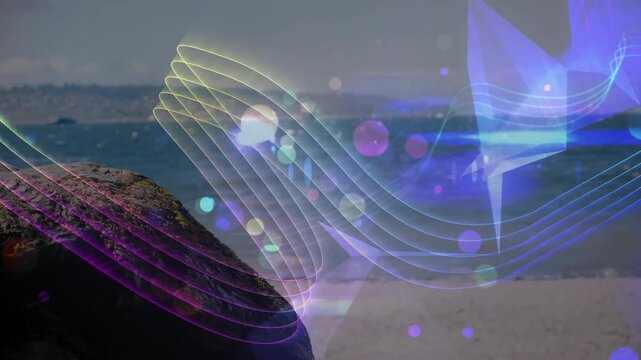 Vertical video: Emerging ribbon sweeping across beach with prism effects over rock left, copy space