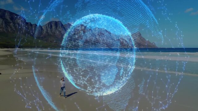 Female beach walker starting behind globe overlaying tech, walking, pausing, shielding eyes