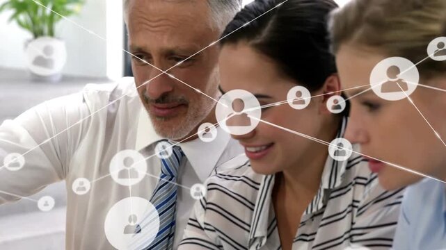 Pointing man in blue tie leading team leaning at office, with shared screen network overlay