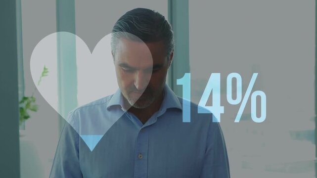 Businessman tapping tablet causing heart graphic and percentage rising 74% while checking progress
