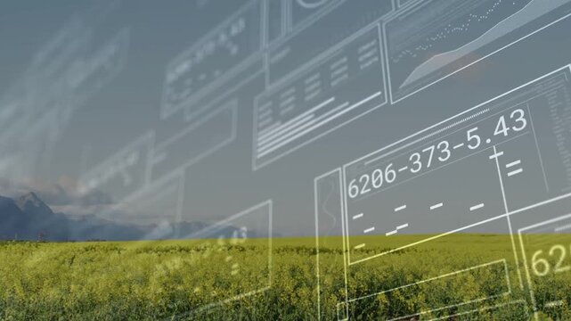 Displaying yellow field on plain with left ridge, faint UI panels appearing and sliding across sky