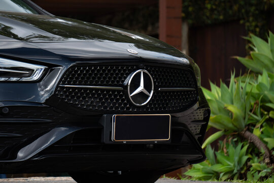 Black Mercedes CLA 200 front grille and emblem close up, Luxury compact sedan front end badge detail