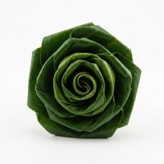 Obraz premium Hand folded rose made from green pandan leaf isolated on white background.