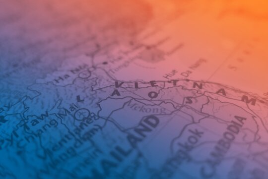 Map of Laos made in orange and blue gradient. Selective focus on label, close-up view