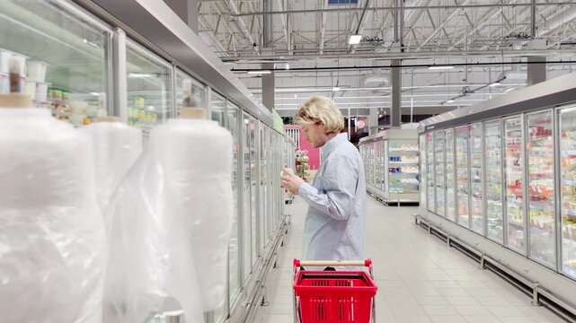 Choosing food from shelf at the supermarket,vegetables in the grocery section, Grocery stores 