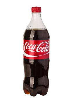 Coca-cola plastic bottle with red label and dark soda