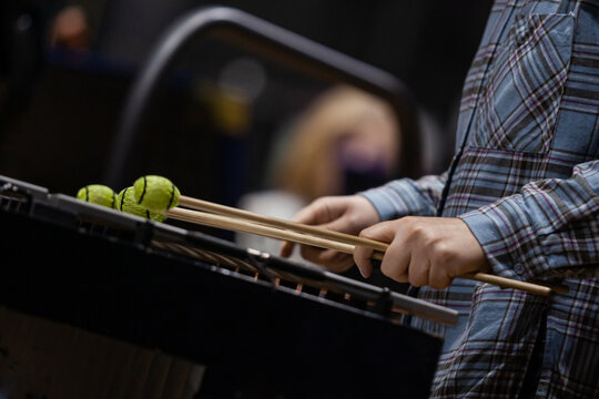 Hands of a girl playing the vibraphone