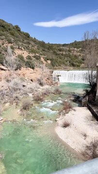 Scenic Salto del Bierge waterfall flowing in Guara, Spain