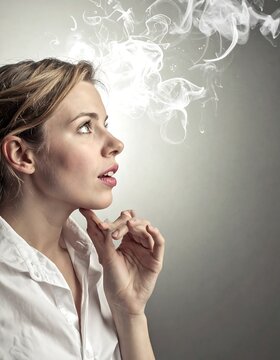 A woman in a white blouse gazes upwards at ethereal wisps, implying thoughts. She appears thoughtful, touching her chin against a neutral background