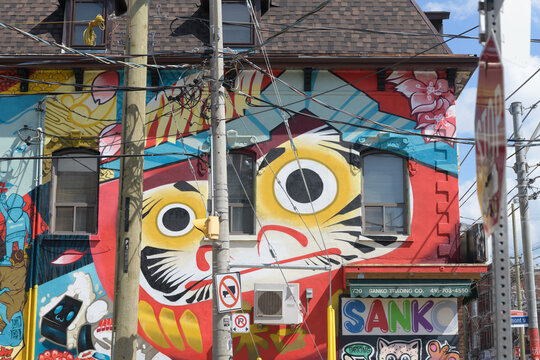 exterior mural and sign of Sanko Trading Co located at 730 Queen St W, Toronto