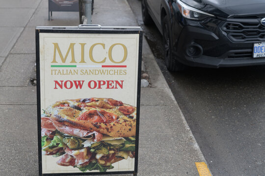 Mico Italian Sandwiches sidewalk sign outside 679 Queen St W, Toronto
