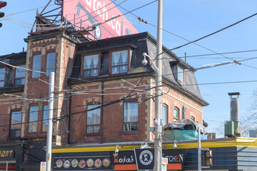 Naklejka premium exterior building and sign of Roja’s Kitchen located at 1647 Queen St W, Toronto