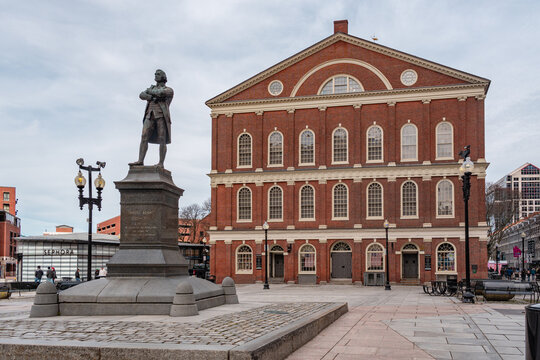 Boston, MA, US-March 28, 2026: Statue of Samuel Adams in front of historic Faneuil Hall and Quincy Market. The statue was created by Anne Whitney in 1880.