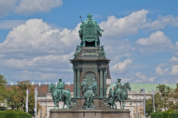 Fototapeta premium Statue of Empress Maria-Theresia , surrouned by field marshalls on horses and four women depicting cardinal virtues of justice, strength, mildness and wisdom. Vienna, Austria 