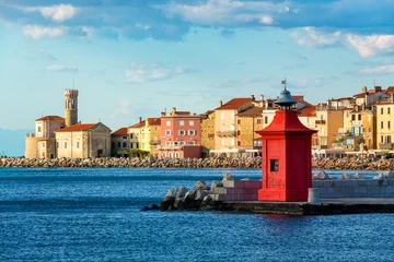 A red lighthouse and the Old town of Piran, Slovenia © Boris Stroujko