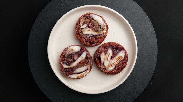 Young coconut Bha Bin (Thai coconut pancake) recipe with black glutinous rice flour.Top view.