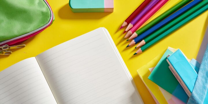 Stationery Items With Colorful Pencils and a Notebook on a Bright Surface
