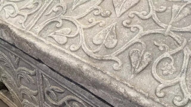 Ancient Stone Sarcophagus with Ornate Vine and Leaf Carvings