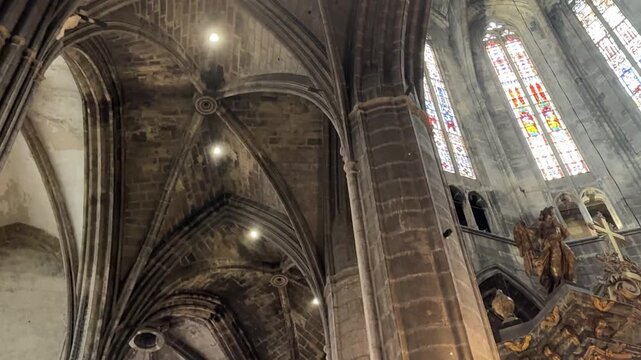 Soaring Gothic Nave and Pillars of the Narbonne Cathedral Interior