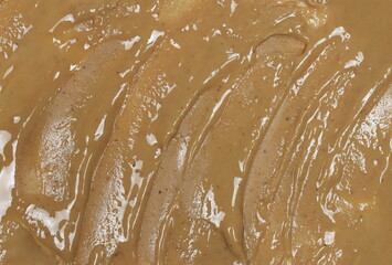 Obraz premium Cashew butter spread background and texture, top view