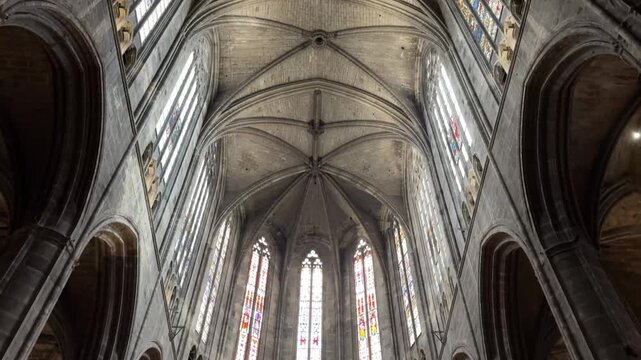 Soaring Gothic Nave and Pillars of the Narbonne Cathedral Interior
