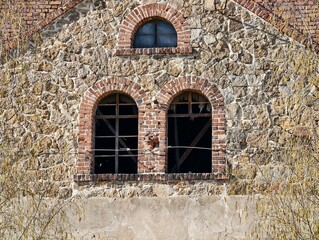 Architectural charm preservation. Elegant stone building featuring symmetrical arches and craftsmanship © Vladimir