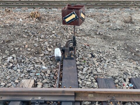 Old metal and wood stop. Aged and rusty railway buffer indicating neglect and aging infrastructure