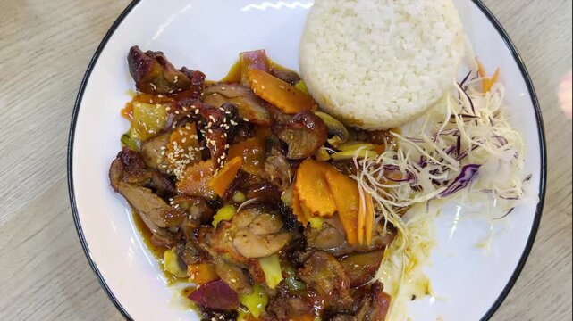 Trying local Asian street food.Tourist man eating asian food street local cafe