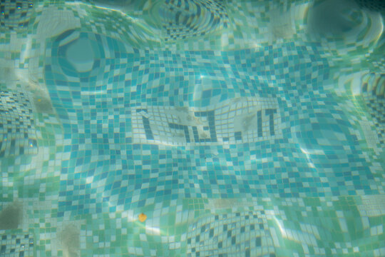 abstract distorted blue swimming pool mosaic tiles background with bubbles and ripples