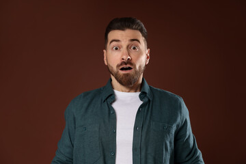 Obraz premium Resentment. Portrait of disturbed man on brown background