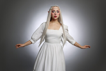 Naklejka premium Beautiful elf girl on grey gradient background