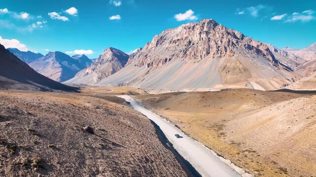 SUV, 4x4, off-road, dirt road, driving, vehicle, car, tracking shot, road trip, adventure, freedom, isolation, solo travel, epic, cinematic, scale, vast, barren, cold desert, Himalayas, Spiti Valley, 