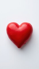 Obraz premium A red heart shaped decorative piece, often associated with romantic gestures and the holiday of love.
