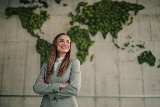 Businesswoman looking forward to sustainability and green corporate environmental responsibility
