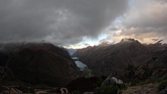 Sunrise mountain timelapse of clouds rolling over the Andes peaks near Laguna 69, Peru