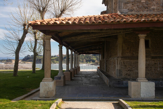 View of Luanco village from the park and the arcades of the church of Santa Maria by the Waterfront
