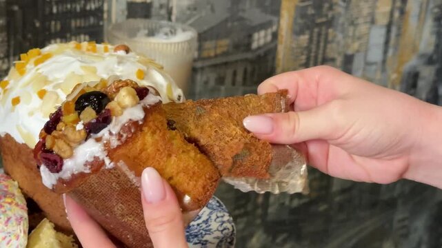 Different panettone and Easter breads are sliced to reveal their texture. Clips show unpacking store-bought loaves and examining the soft, airy structure. Close-up view of festive dessert preparation.