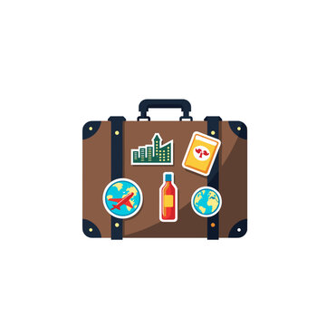 A vintage brown suitcase with travel stickers sits on a transparent background. This item represents international adventures and holiday getaways, with copy space.