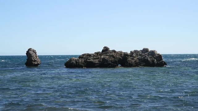 Sunset Ocean Waves Hitting Rocky Islands &ndash; Dramatic Mediterranean Seascape