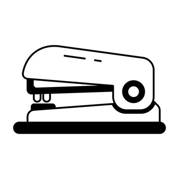 A glyph style icon showing a stapler