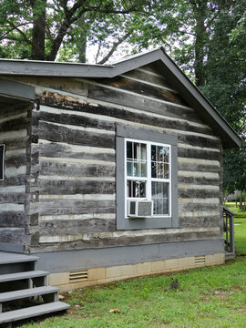 Old Log Cabin with Window AC unit